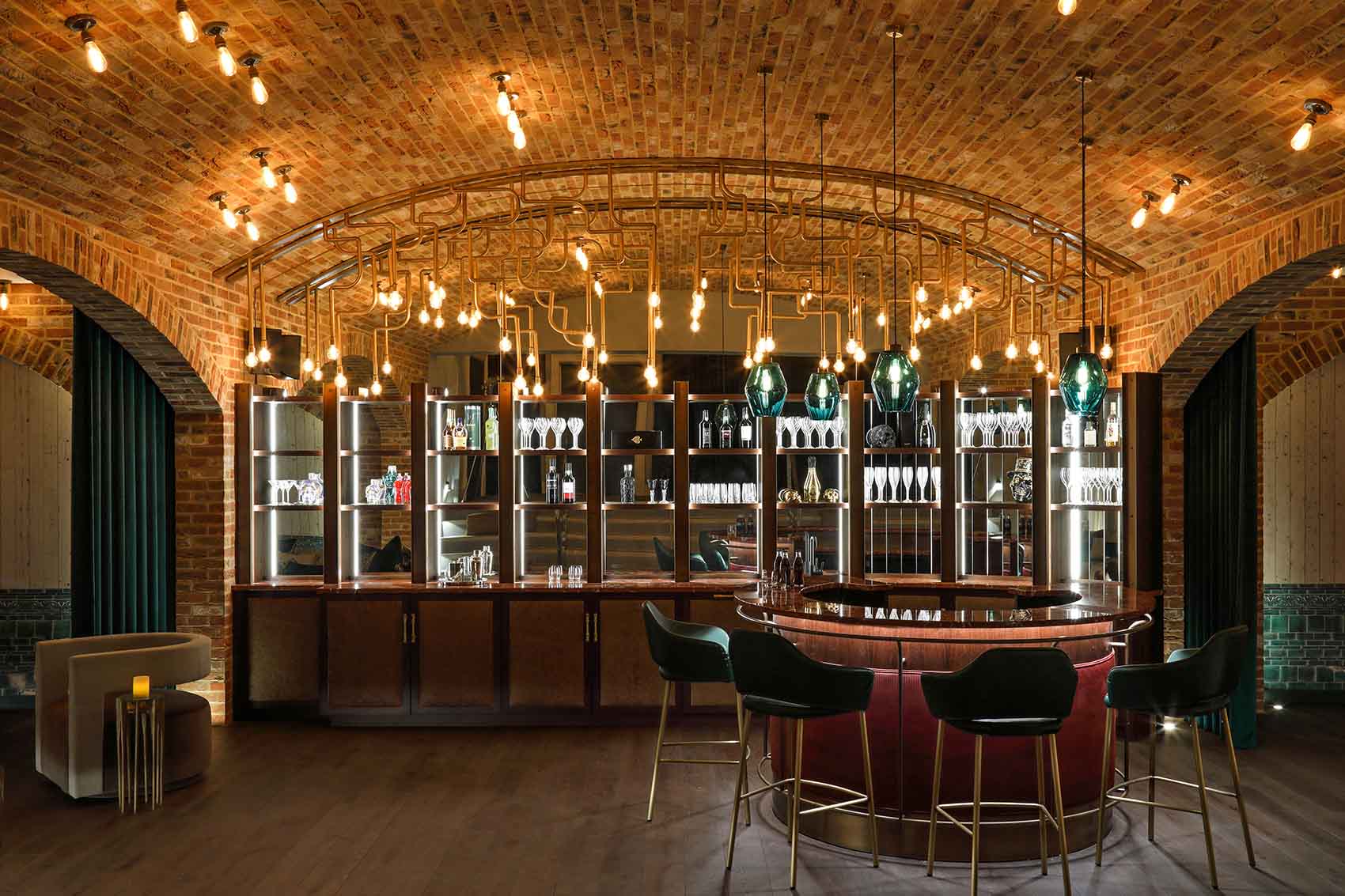 Cool underground station inspired bar and party room with leather bar and Penta pendants